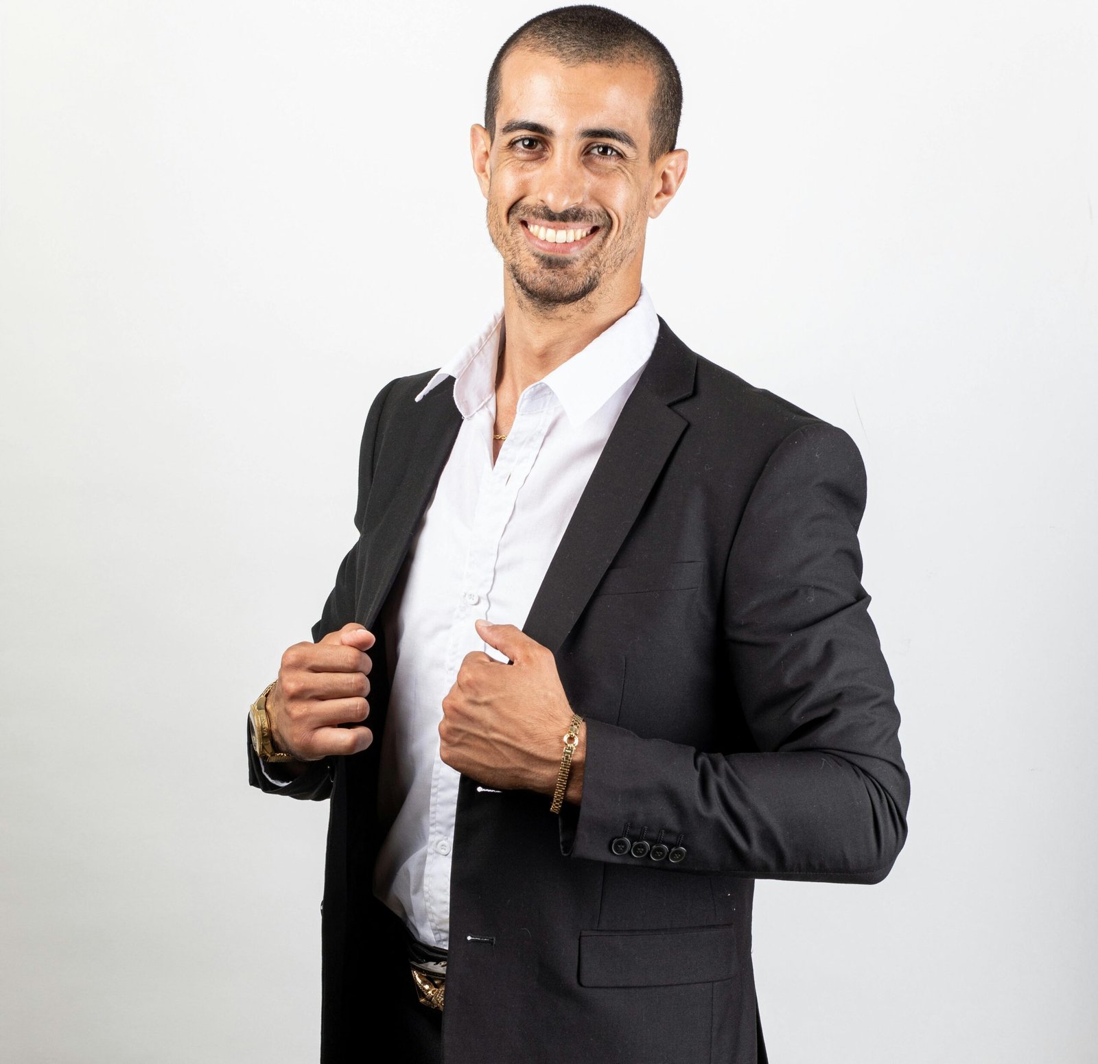 A confident businessman in a suit with a friendly smile, showcasing professionalism and success.